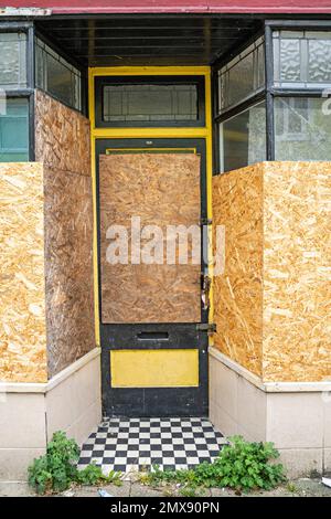 Boarded up shop front Stock Photo