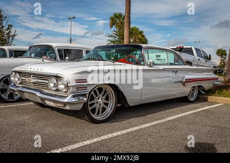 Daytona Beach, FL - November 26, 2022: Low perspective front corner view of a 1960 Chevrolet Impala 2 Door Hardtop at a local car show. Stock Photo