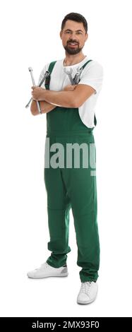 Full length portrait of professional auto mechanic with wrenches on white background Stock Photo