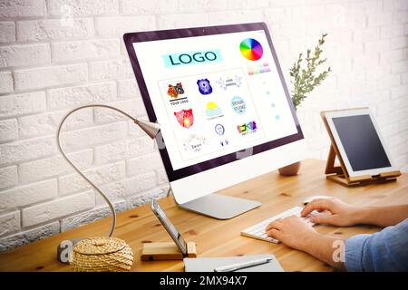 Professional male designer working at desk in modern office, closeup Stock Photo