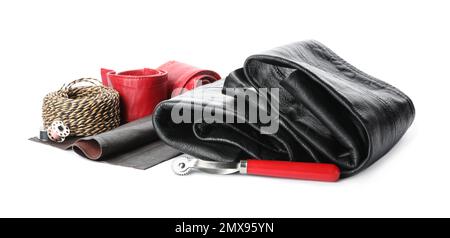 Leather samples and craftsman tools isolated on white Stock Photo