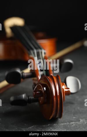 Classic violin and bow on grey stone table, closeup Stock Photo