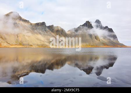 Vestrahorn mountain reflected in the sea, Stokksnes, Iceland Stock Photo