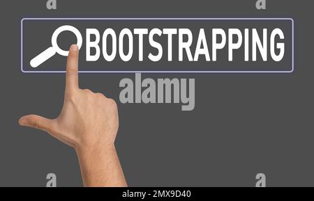 Man touching virtual screen with word BOOTSTRAPPING in search bar on dark grey background, closeup Stock Photo