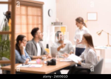 Blurred view of professional interior designers working in office Stock Photo