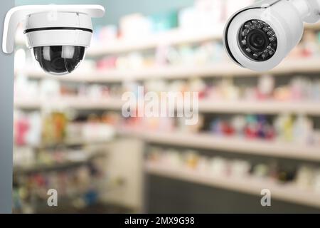 Modern CCTV security cameras in shop. Guard equipment Stock Photo