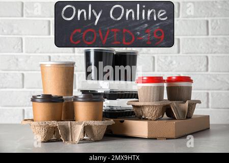 Various takeout containers on table. Online food delivery service Stock Photo