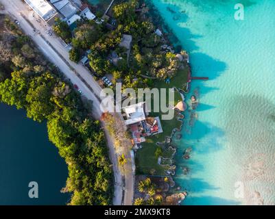 Aerial Top View on narrow line of land between Cenote Azul and 7 seven colors lagoon in Bacalar, Quintana Roo, Mexico Stock Photo