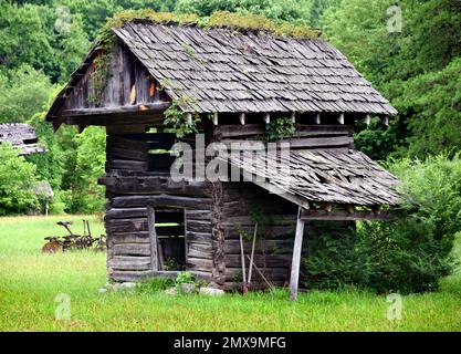 Log cabin, smokehouse, is part of the Homeplace Mountain Farm and Museum in Southwest Virginia, Gate City. Stock Photo