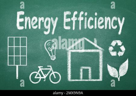 Energy efficiency concept. House and different icons drawn on chalkboard Stock Photo