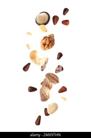 Different nuts falling on white background Stock Photo