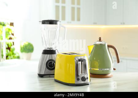 Kitchen Appliances Set. Red Blender, Toaster, Coffee Machine, Meat Ginder,  Food Mixer and Coffee Grinder on a wooden table. 3d Rendering Stock Photo -  Alamy
