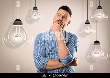 Lightbulbs illustration and thoughtful man in casual outfit on beige background. Business idea Stock Photo