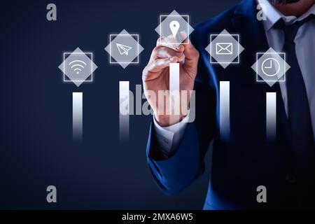 Core values concept. Businessman touching icon on virtual screen Stock Photo