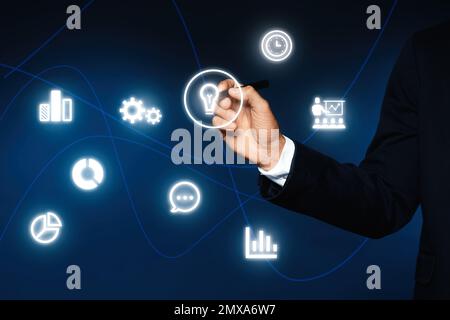 Core values concept. Businessman touching icon on virtual screen Stock Photo