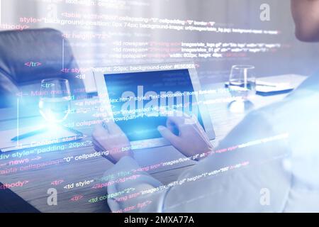Double exposure of female programmer using tablet and source code written in programming language, closeup Stock Photo