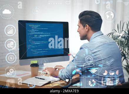Professional programmer working with computer in office Stock Photo