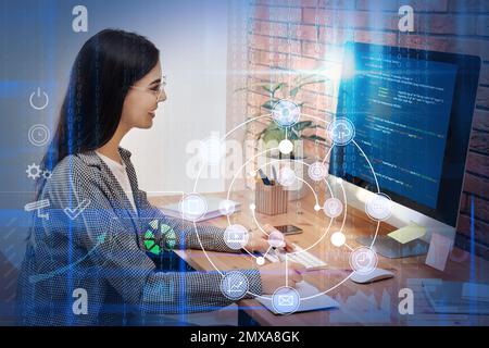 Professional programmer working with computer in office Stock Photo