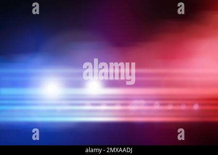 Blurred view of police car on street at night Stock Photo