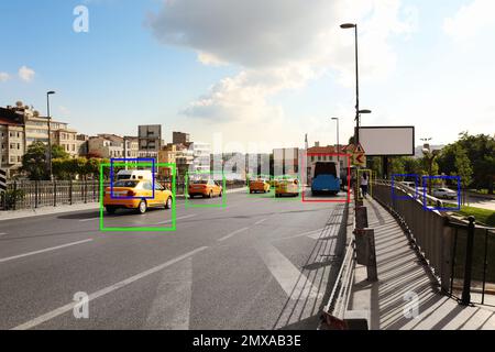 City road with scanner frames on cars outdoors. Machine learning Stock Photo