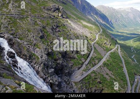 Mountain pass in Zig-Zag barren mountains, waterfall, narrow valley, Trollstigen, Way of the Trolls, Andalsnes, Norway Stock Photo