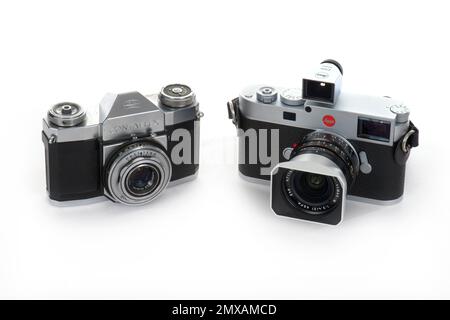 Camera history, Zeiss-Ikon Contaflex with Tessar 2. 8 45mm from 1959 and Leica M11 from 2022, Germany Stock Photo