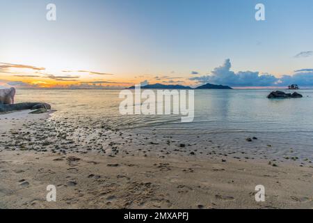 Anse Source d'Argent beach at sunset on La Digue island in the Seychelles Stock Photo