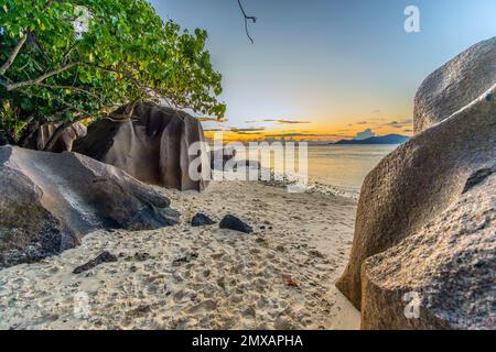 Anse Source d'Argent beach at sunset on La Digue island in the Seychelles Stock Photo