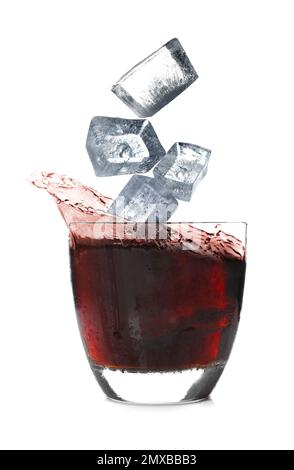Ice Cubes Falling into Glass of Coke against White Background Stock ...