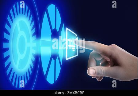Man clicking on document icon using virtual screen, closeup Stock Photo