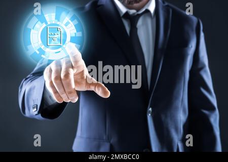 Businessman clicking on document icon using virtual screen, closeup Stock Photo