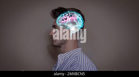 Thinking concept. Young man and illustrated brain on color background Stock Photo