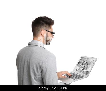 Man monitoring modern cctv cameras on laptop. Home security system Stock Photo