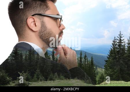 Double exposure of businessman and mountain landscape Stock Photo