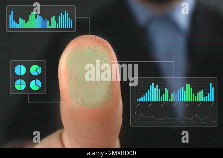 Businessman using biometric fingerprint scanner, closeup view Stock Photo