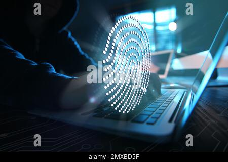 Fingerprint identification. Man working with laptop at table, closeup Stock Photo