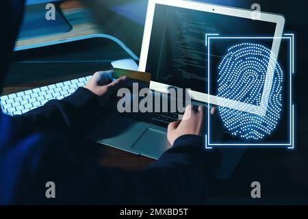 Fingerprint identification. Man working with laptop at table, closeup Stock Photo