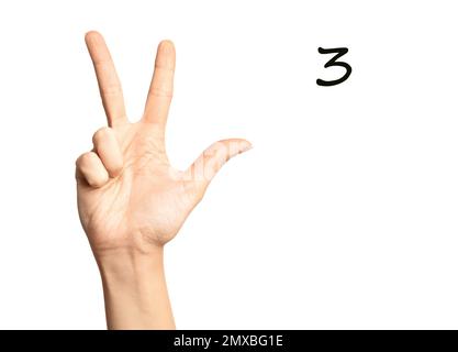 Woman showing number three on white background, closeup. Sign language Stock Photo