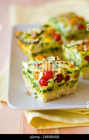 slices of vegetable gratin(quiche) with zucchini,tomato cherry and rice