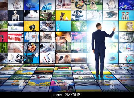 Media library concept. Man using virtual video gallery Stock Photo