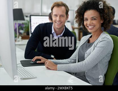 Great working relationships for strong teams. Portrait of male and female colleagues smiling at the camera. Stock Photo