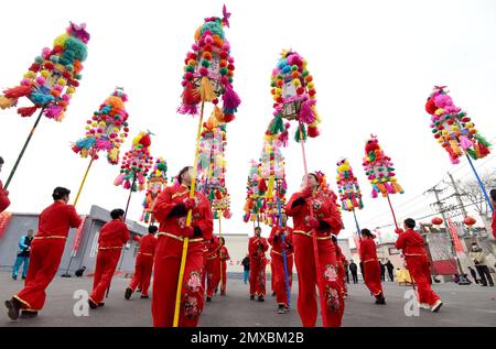 HANDAN, CHINA - FEBRUARY 3, 2023 - Villagers perform the intangible cultural heritage 'Weizi Lantern Array' to celebrate the Lantern Festival in Handa Stock Photo