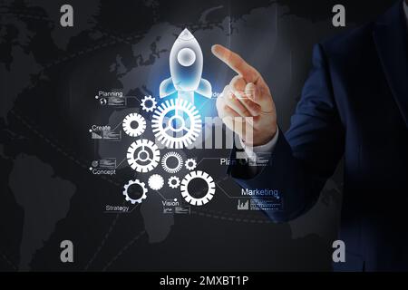 Startup concept. Businessman on dark background, closeup Stock Photo