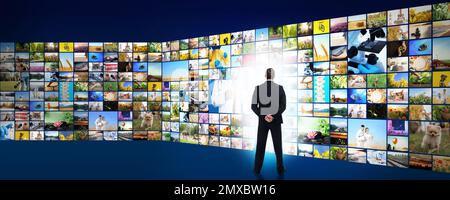Media library concept. Man using virtual video gallery, banner design Stock Photo
