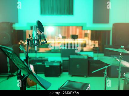 Music, recording studio and interior with instruments for creative, musician or industry background. Audio technology, microphone and sound production Stock Photo
