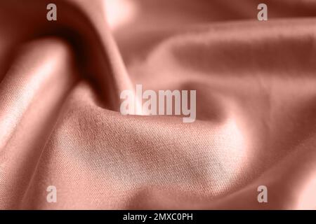 Textured rose gold fabric as background, closeup view Stock Photo