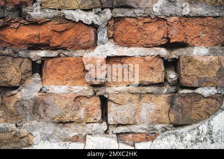 texture of old cracked and destroyed red brick wall Stock Photo