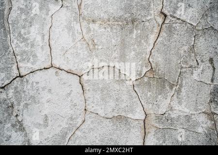 close up texture of cracked plaster on old house wall Stock Photo
