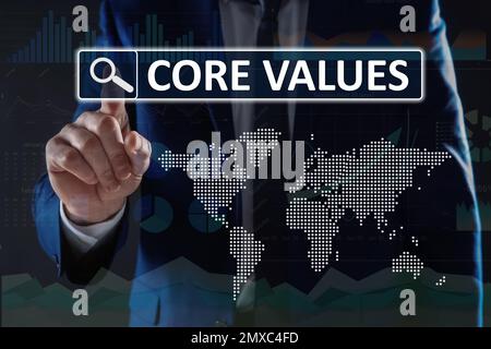 Core values concept. Businessman using virtual screen Stock Photo