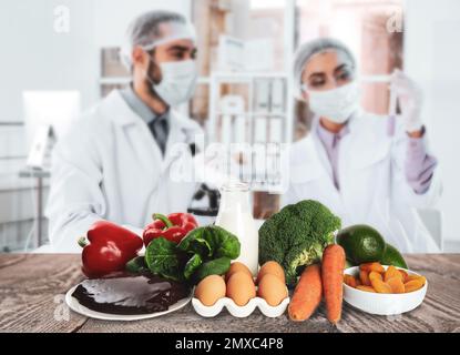 Scientists inspecting products in laboratory. Food quality control Stock Photo